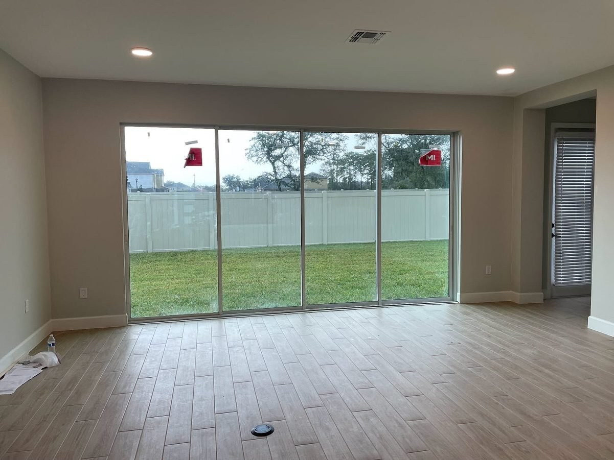 Custom sliding glass doors opening to backyard, Central Florida