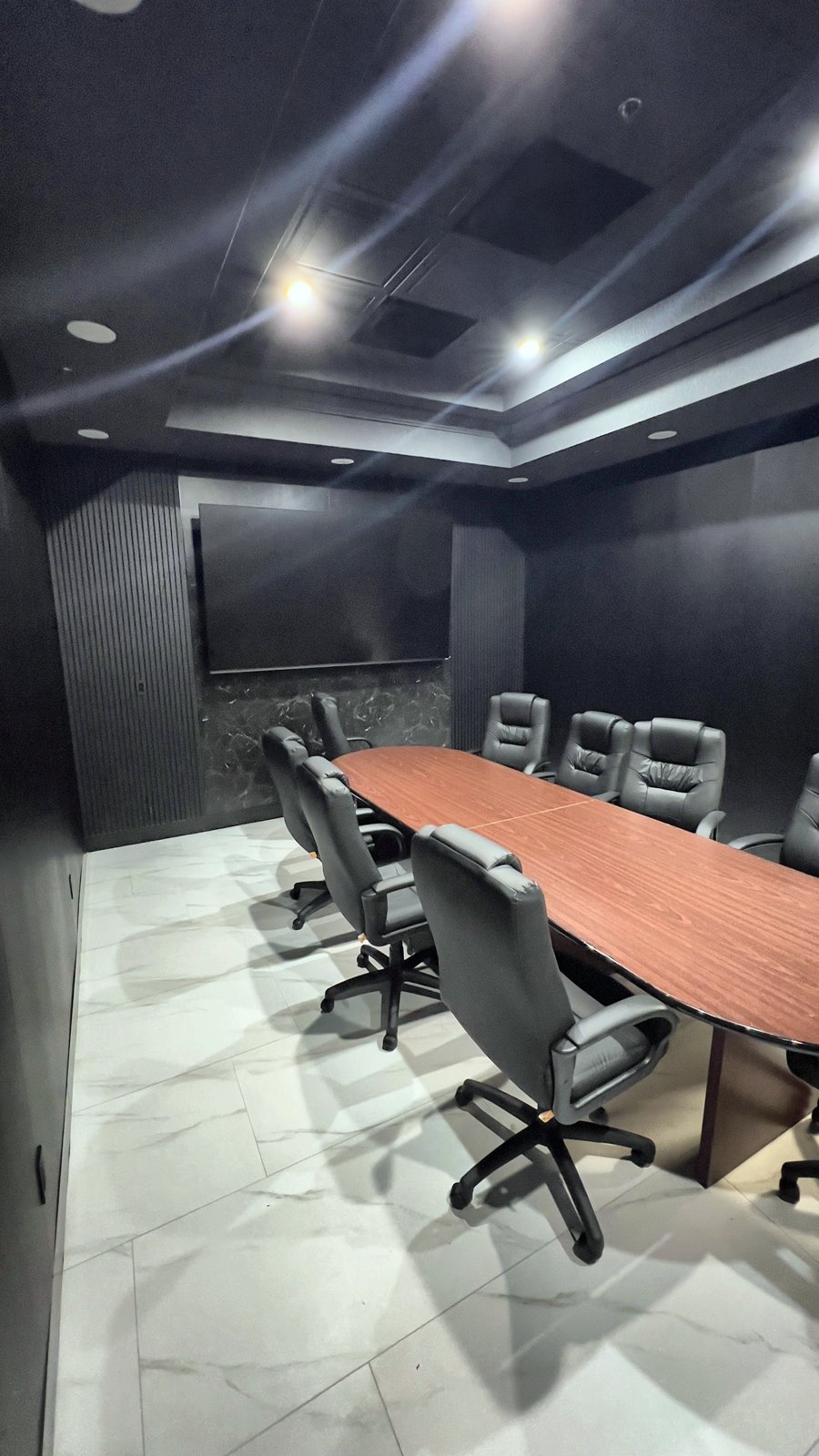 Commercial office remodel in Lake Mary FL — conference room with slat wall and LED cove ceiling