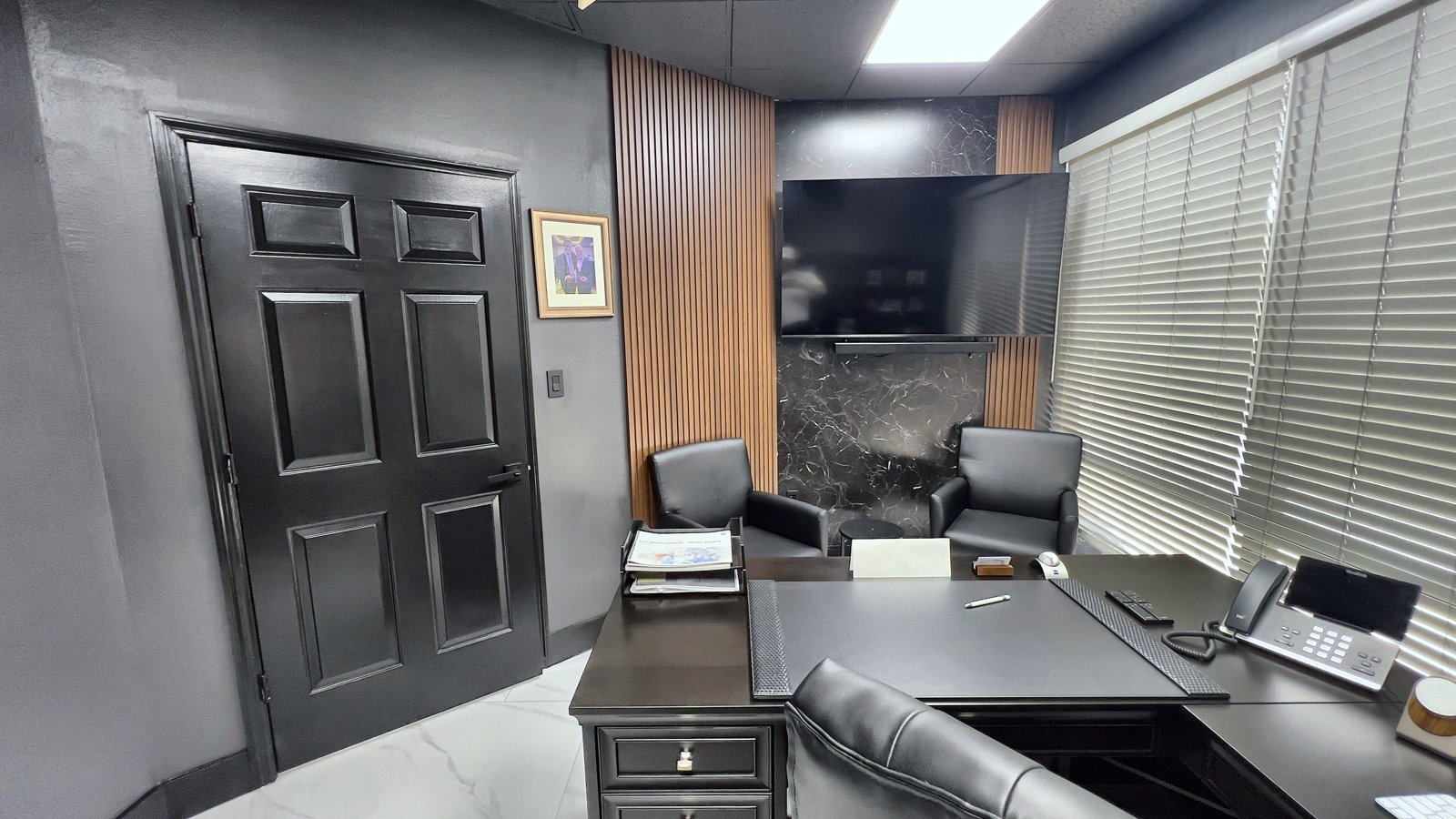 Private office with dark built-ins and new lighting — office remodel Lake Mary FL