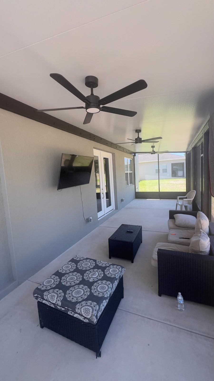 Completed home addition living space with ceiling fan in Central Florida