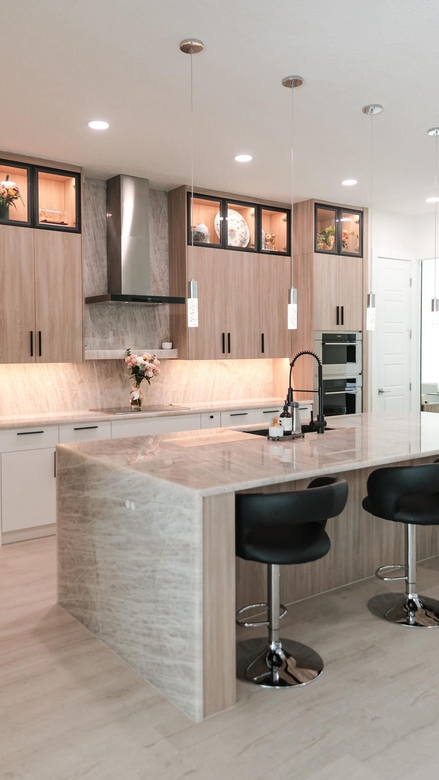 Modern kitchen remodel with island seating and quartz countertops in Winter Park, FL